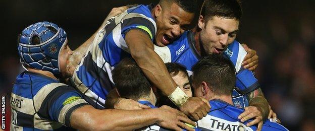 Bath players, including Anthony Watson and Matt Banahan, mob try scorer Horacio Agulla