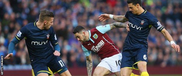 Burnley striker Danny Ings (centre) is closed down by Southampton defenders Toby Alderweireld (left0 and Jose Fonte (right)