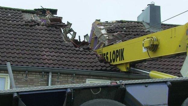 A crane which fell into the roof of a house in the Netherlands