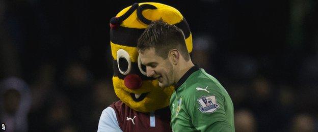 Burnley keeper Tom Heaton is congratulated by the club's mascot after the win over Southampton