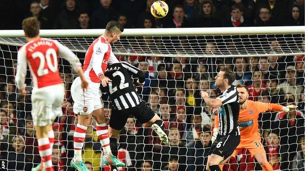 Olivier Giroud heads Arsenal ahead against Newcastle United