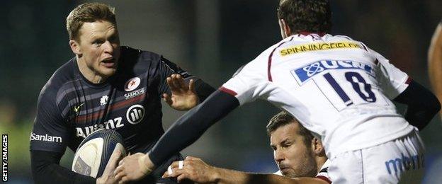 Saracens wing Chris Ashton takes on Sale fly-half Nick Macleod