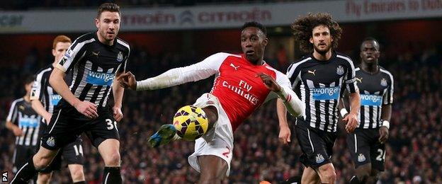 Danny Welbeck has a shot for Arsenal against Newcastle United