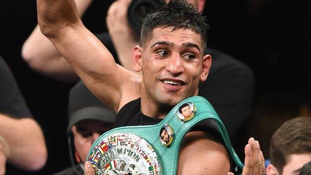 Amir Khan celebrates his win