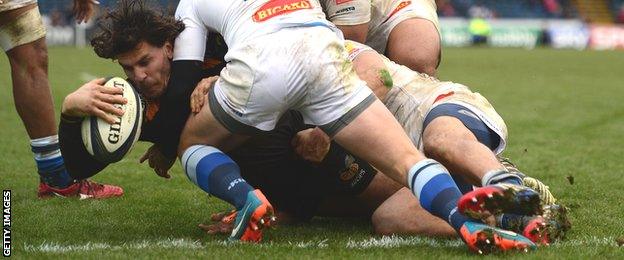 Wasps centre Ben Jacobs battles his way over in the closing seconds at Adams Park