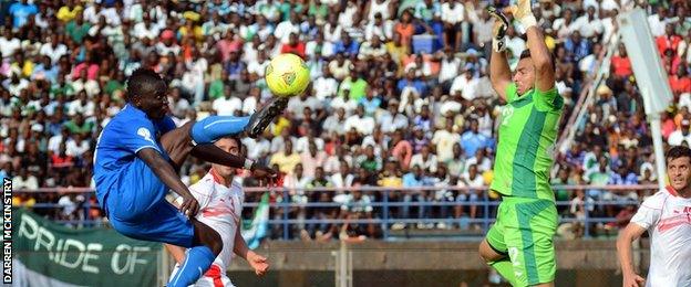 Alhassan 'Crespo' Kamara chips the keeper vs Tunisia