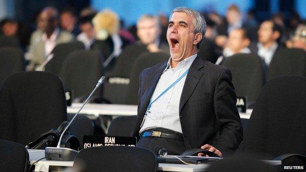 A delegate yawns during a plenary session of the COP 20 talks in Lima.