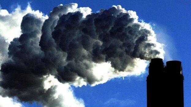 Photo of smoke billowing from a coal-fired power station.