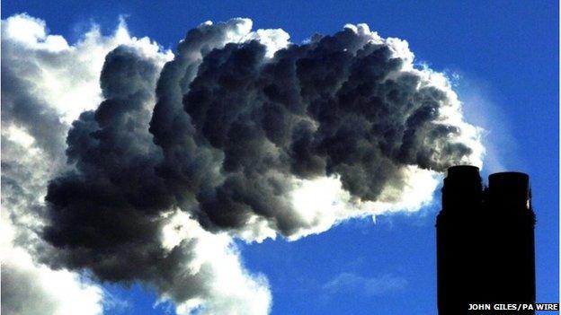 Photo of smoke billowing from a coal-fired power station.