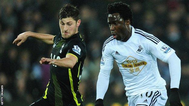 Ben Davies in action against Wilfried Bony