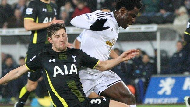 Ben Davies in action against Wilfried Bony