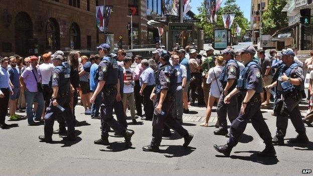 Police walk through Martin Place as spec