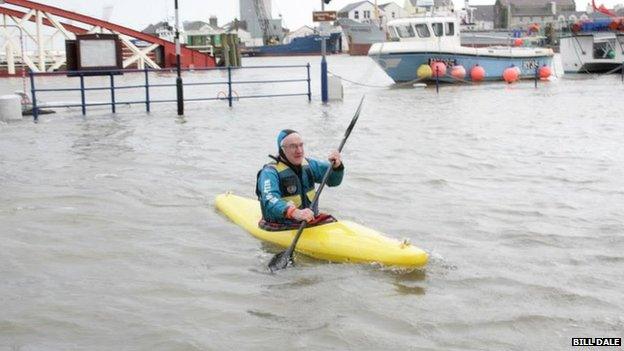 Man in kayak during floods in Ramsey, Isle of Man