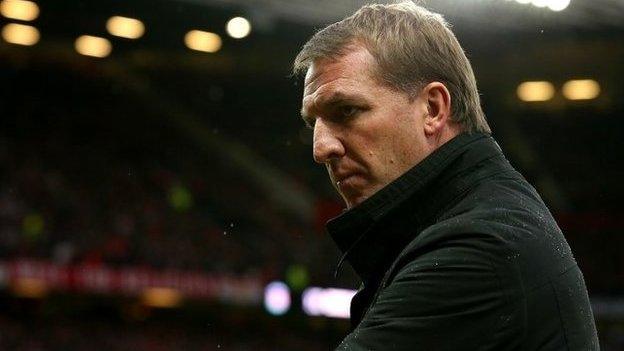 Liverpool boss Brendan Rodgers watches his team lose 3-0 to Manchester United at Old Trafford