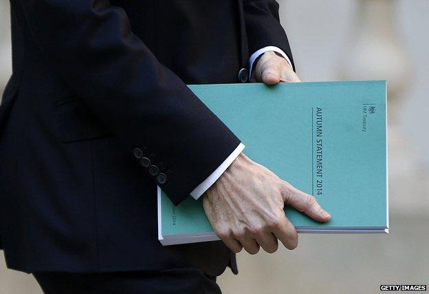 Chancellor carries dossier marked "Autumn Statement 2014"