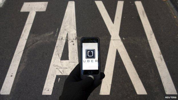 Uber app in front of Taxi road marking