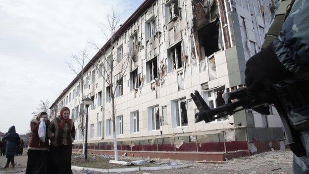 Scene of a gun battle outside a damaged school in the centre of Grozny