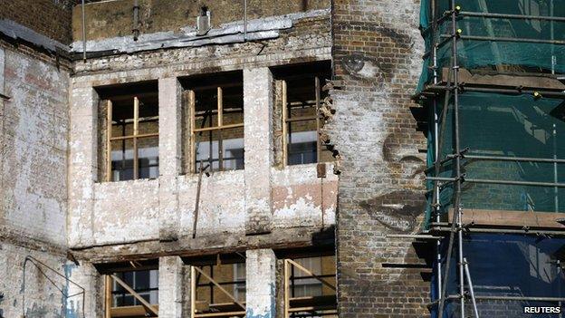 Scaffolding against old building