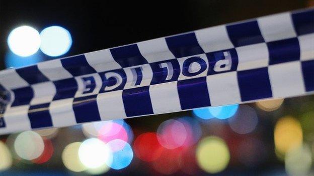 Police tape is streched near the Lindt Chocolate Cafe in Martin Place following a hostage standoff on December 16, 2014 in Sydney, Australia.