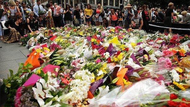 Flowers are left as a sign of respect at Martin Place on December 16, 2014 in Sydney, Australia