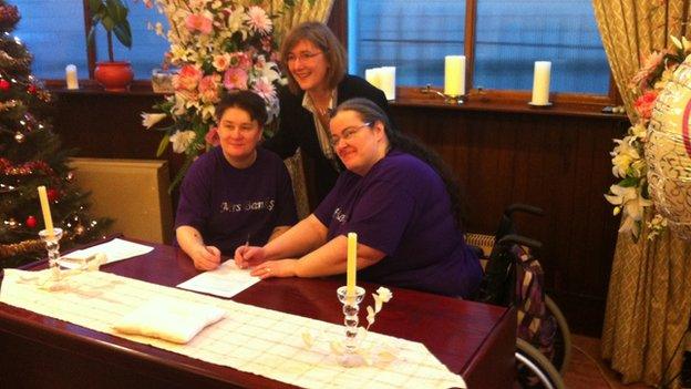 Leanne and Marie Banks signing the documents