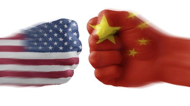 Hands painted with the US and Chinese flags doing a fist bump