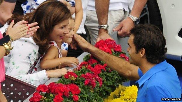 Federer celebrates Madrid Masters final win with wife and daughter