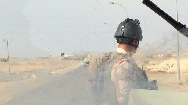 Soldier guards outside the base