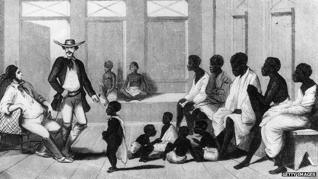 Brazilian slave traders inspect a group of Africans shipped into the country for sale.