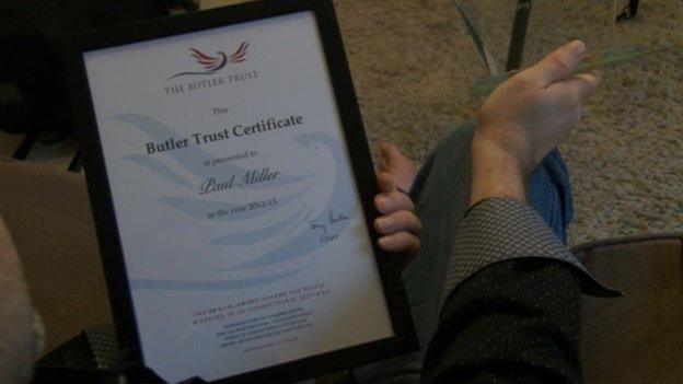 Paul Miller looking at certificate