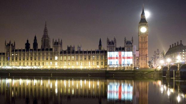 An image of the English flag with the words 'Home Rule' was projected onto the Houses of Parliament by democracy group POWER2010 as part of a St George's Day protest to demand an end to non-English MPs voting on English laws at Westminster.