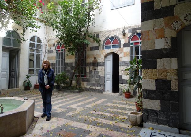 Diana Darke in the courtyard of her house