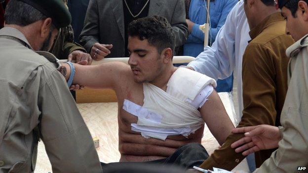 An injured student receiving medical treatment in Peshawar, Pakistan