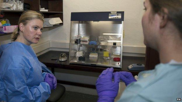 Justine Greening in an Ebola testing laboratory