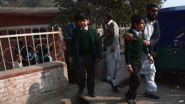 Children leave a park near their school. 16 Dec 2014