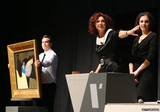 Auction at the Judit Virag Gallery in Budapest on December 13, 2014, next to the painting 'Sleeping woman with black vase' of Hungarian artist Robert Bereny.