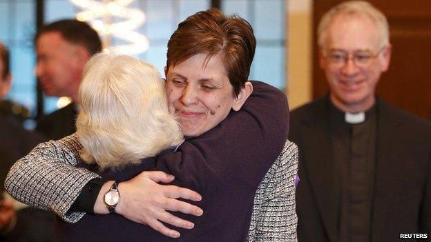 Libby Lane hugged by female member of the clergy