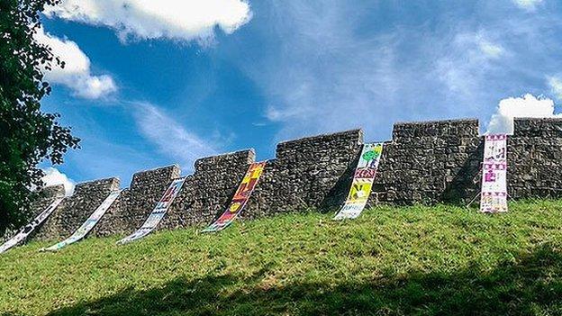 Banners hung on York city walls