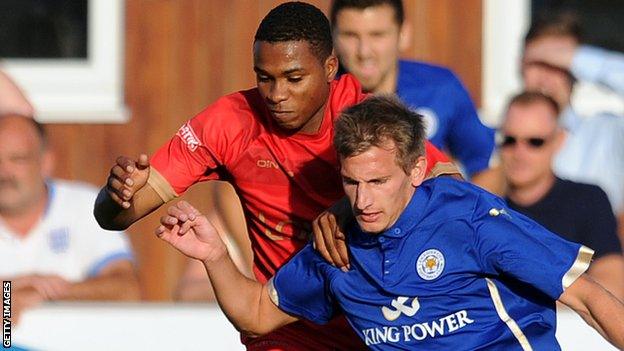 Kane Richards challenges Leicester City's Marc Albrighton in a pre-season friendly