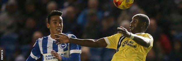 Adam Chicksen and Millwall's Magaye Gueye