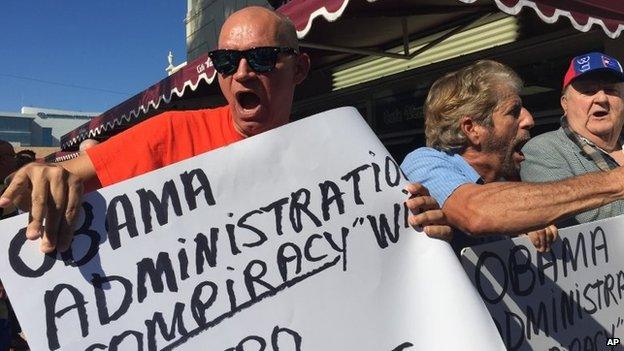 Protesters outside of Cafe Versailles on Calle Ocho in Miami protest on 17 December 2014