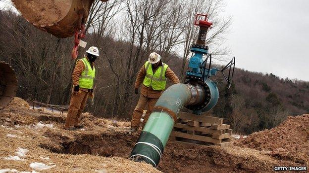 Two men at work at a hydraulic fracturing site in Pennsylvania