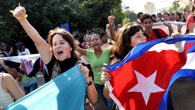 Cuban students march in a street of Havana, on 17 December 2014