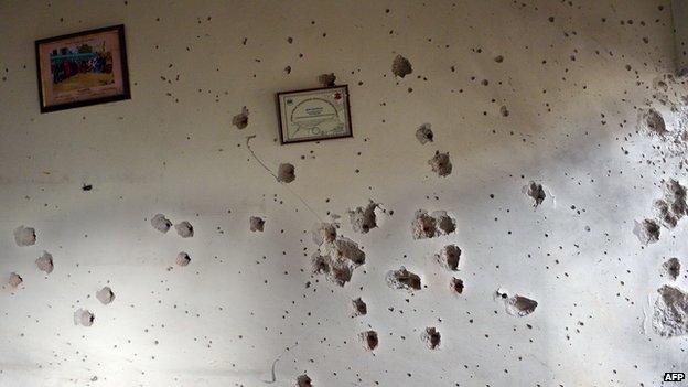 Bullet holes in the wall of a school in Pakistan following a massacre there