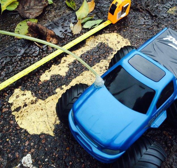 Toy truck on yellow lines