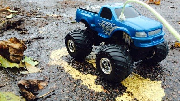 Toy truck on yellow lines