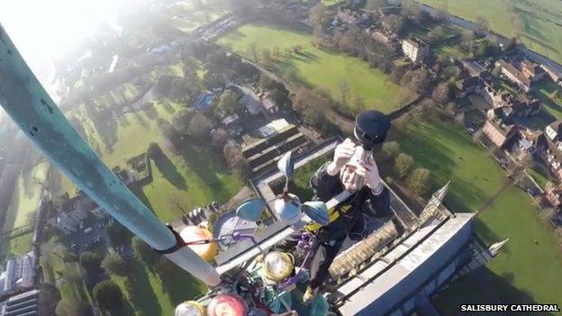 Worker at the top of the Salisbury Cathedral spire