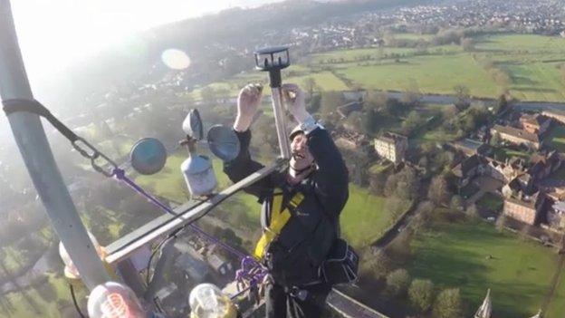 Worker at the top of the Salisbury Cathedral spire