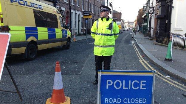 Police man on cordoned off street