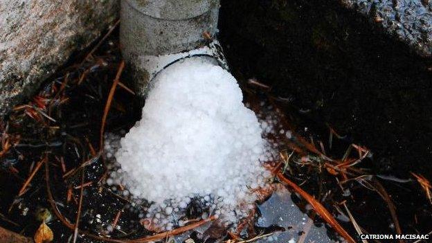 Hailstones choke a drainpipe in Kilchoan